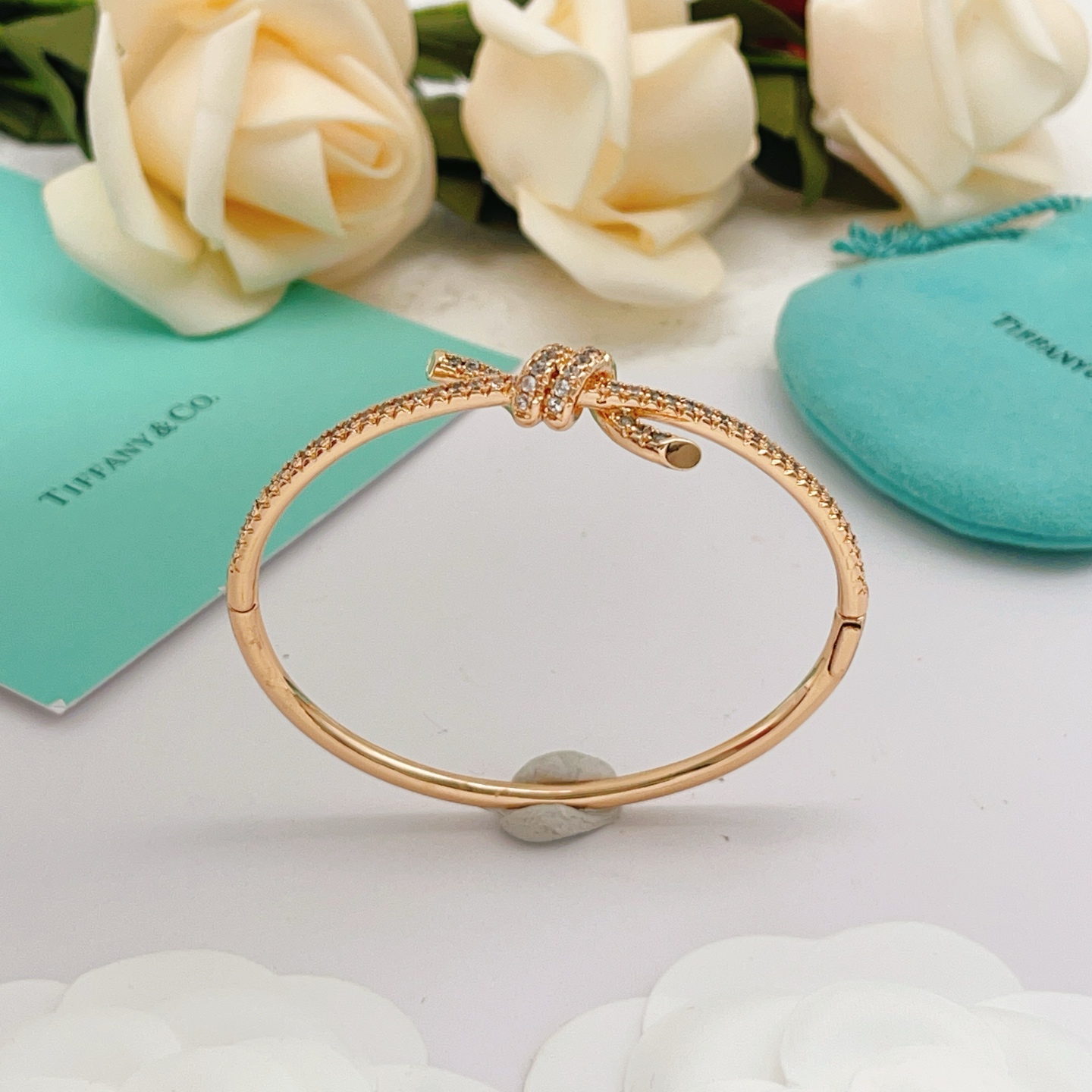 Tiffany Co Tiffany Knot bracelet 18k rose gold with pave set clear diamonds 17cm inner circumference