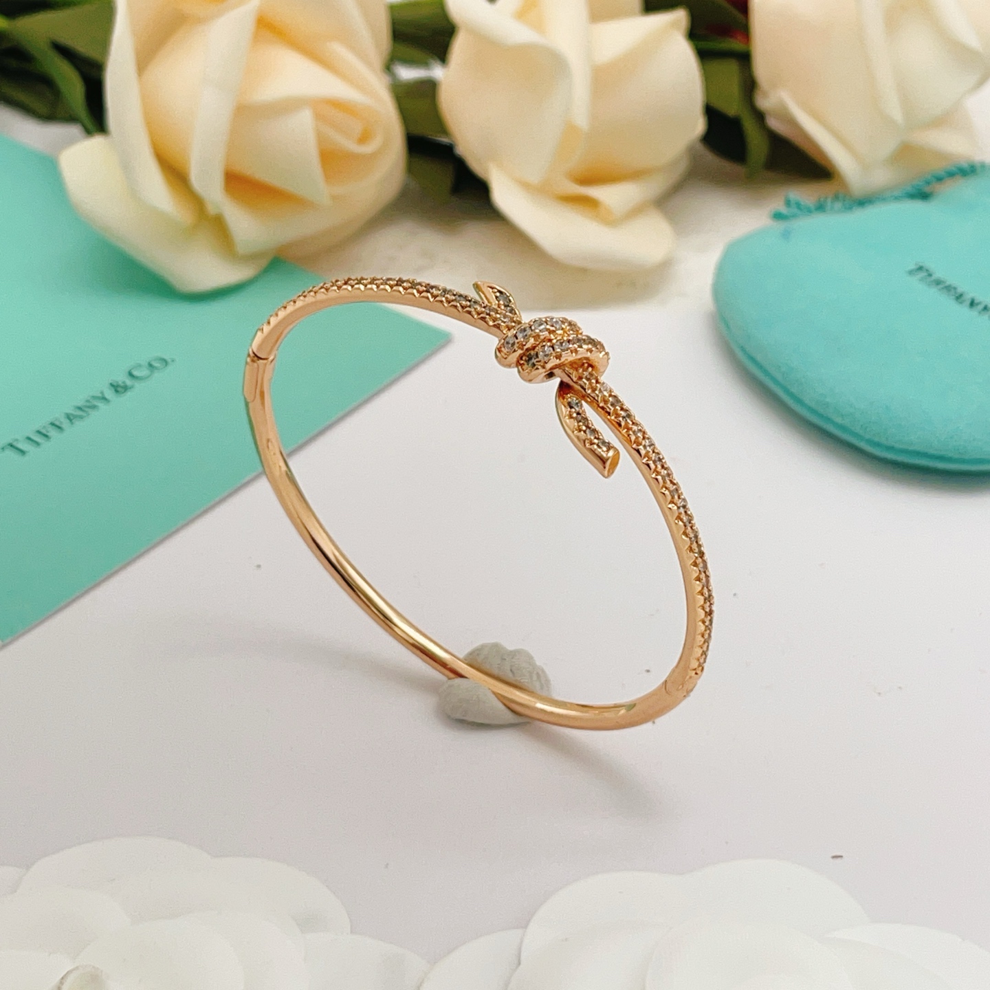 Tiffany Co Tiffany Knot bracelet 18k rose gold with pave set clear diamonds 17cm inner circumference