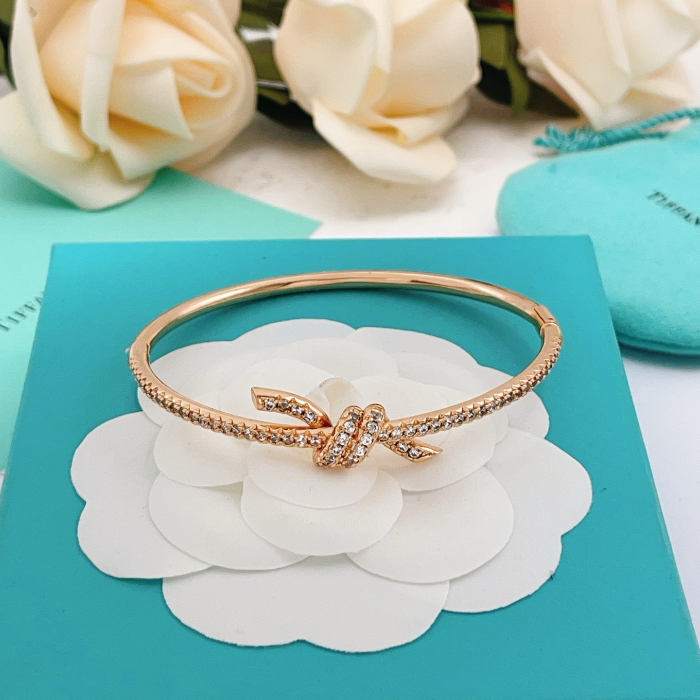 Tiffany Co Tiffany Knot bracelet 18k rose gold with pave set clear diamonds 17cm inner circumference