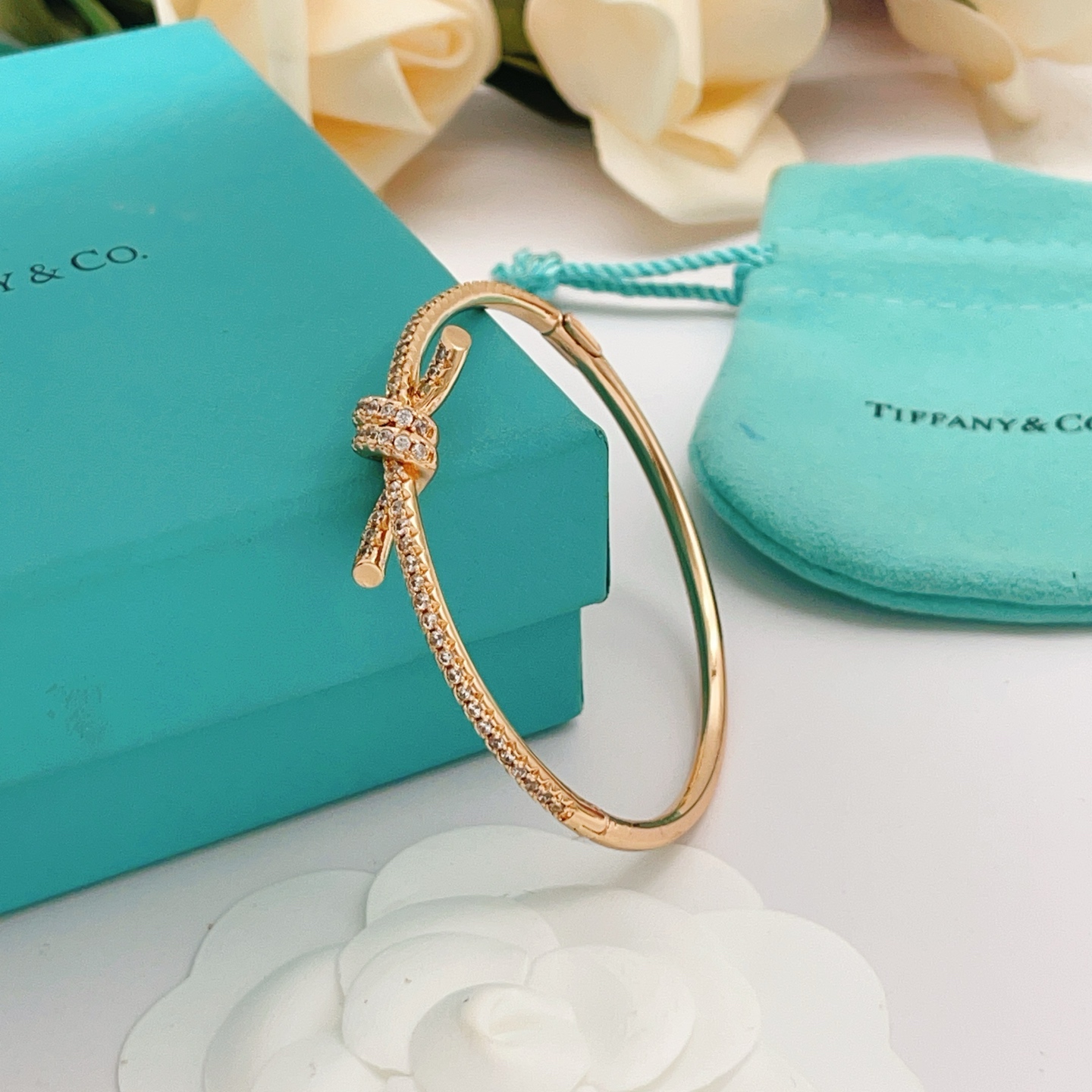 Tiffany Co Tiffany Knot bracelet 18k rose gold with pave set clear diamonds 17cm inner circumference