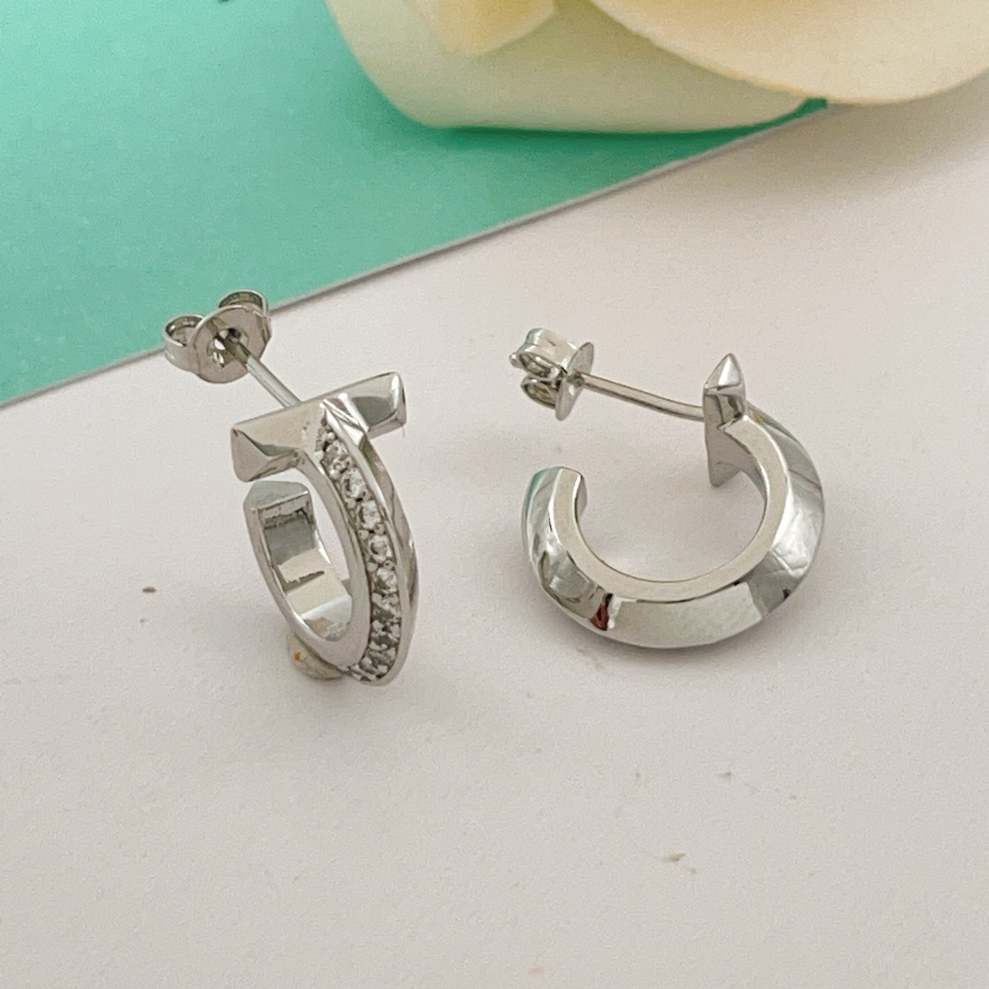 Tiffany T T1 earrings silver-toned metal with clear diamond accents 10mm hoop diameter