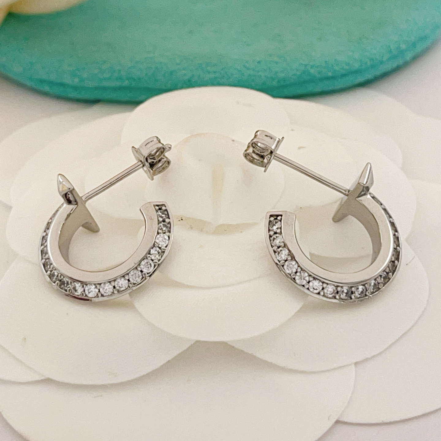 Tiffany T T1 earrings silver-toned metal with clear diamond accents 10mm hoop diameter