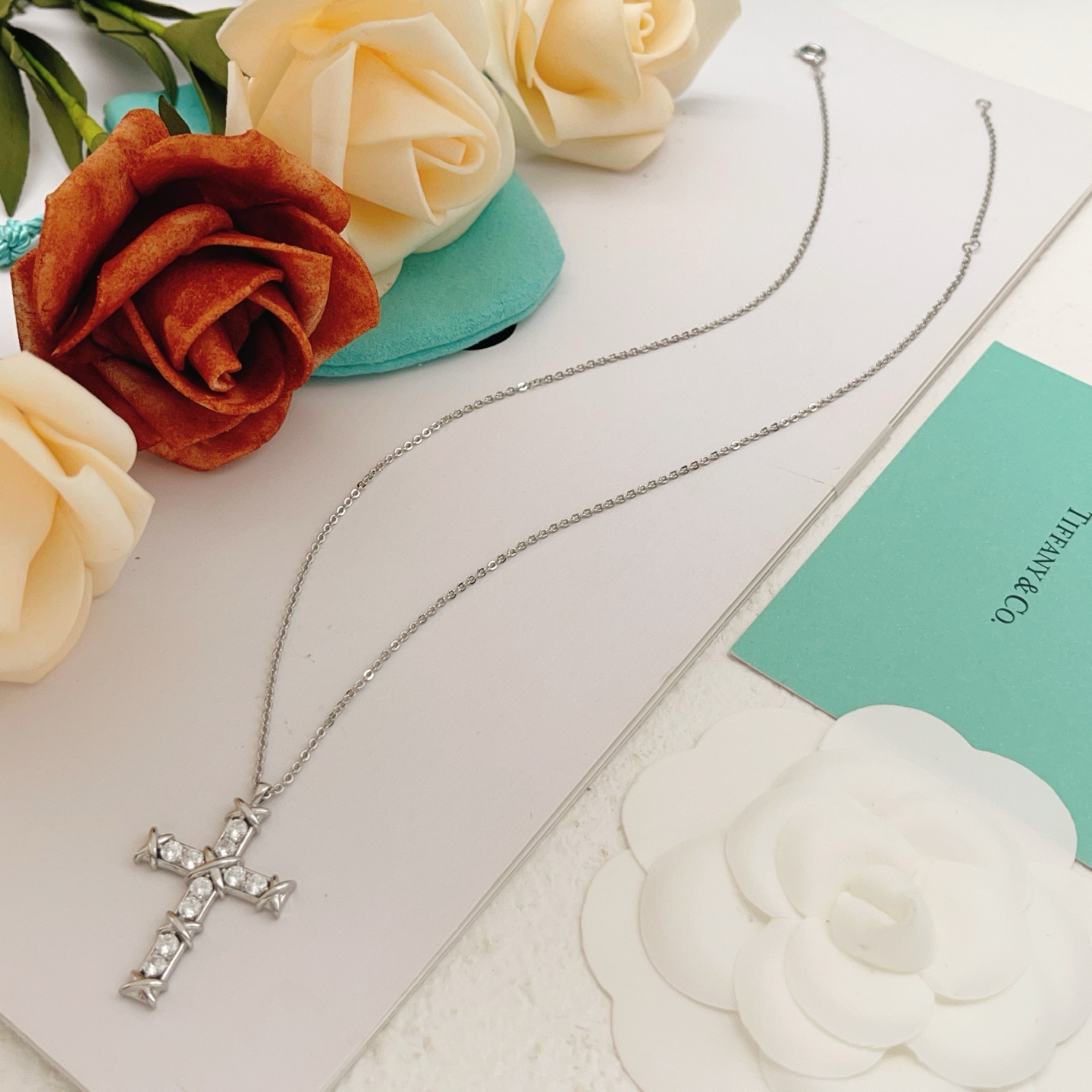 Tiffany Co Signature X Cross Pendant necklace Sterling silver with clear round brilliant gemstones 18 inches with 2 inch extender