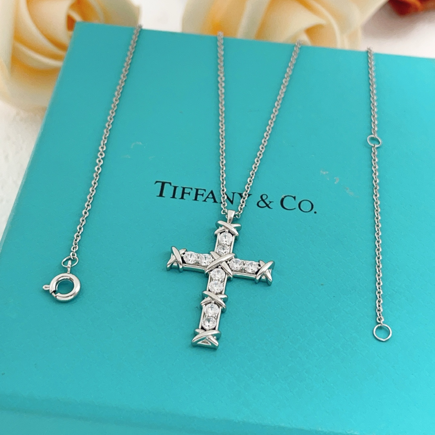 Tiffany Co Signature X Cross Pendant necklace Sterling silver with clear round brilliant gemstones 18 inches with 2 inch extender