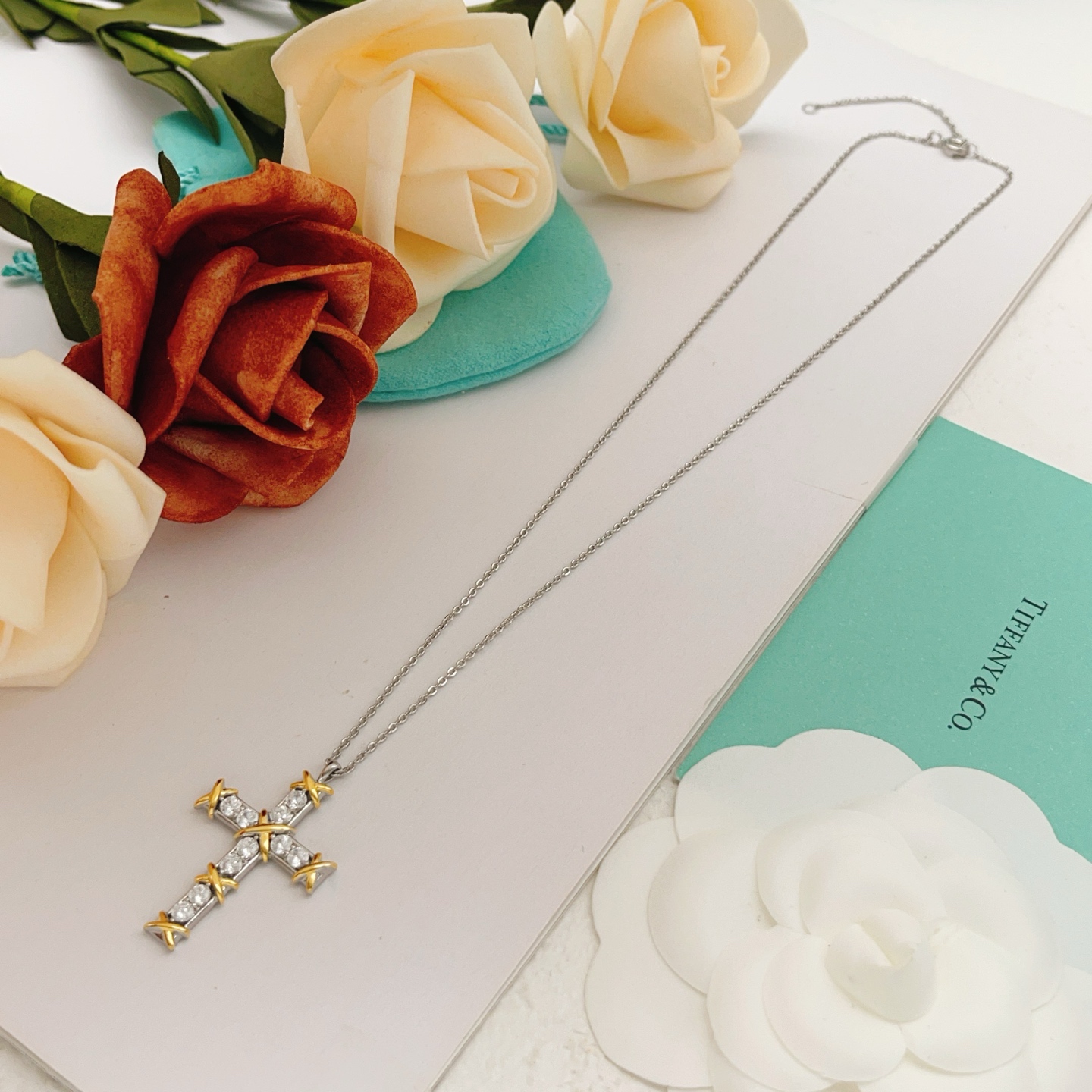Tiffany Co Jean Schlumberger Cross Pendant necklace Sterling silver and 18k yellow gold with clear round diamonds 18 inches