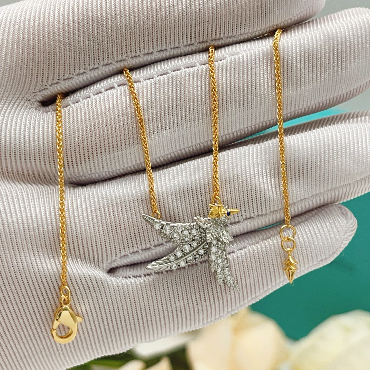 Tiffany Co Bird on a Point necklace Two-tone yellow gold and platinum-plated metal clear pave diamonds blue sapphire eye 18 inches