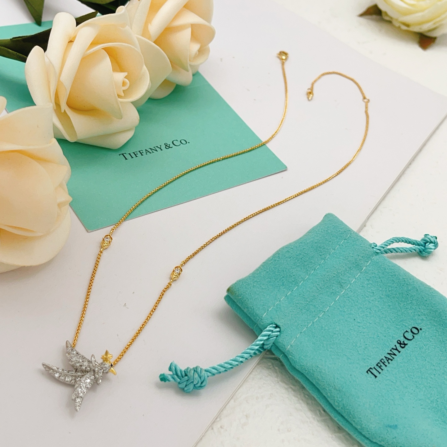 Tiffany Co Bird on a Point necklace Two-tone yellow gold and platinum-plated metal clear pave diamonds blue sapphire eye 18 inches
