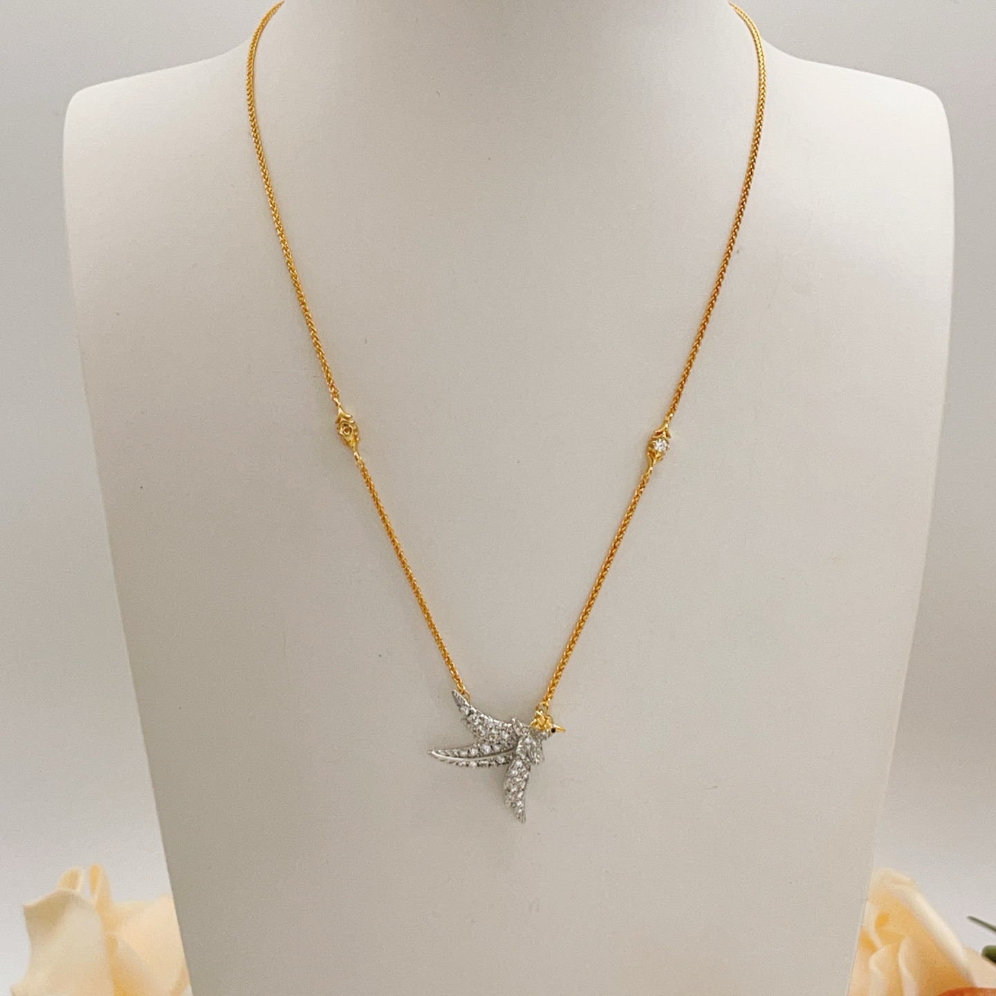 Tiffany Co Bird on a Point necklace Two-tone yellow gold and platinum-plated metal clear pave diamonds blue sapphire eye 18 inches