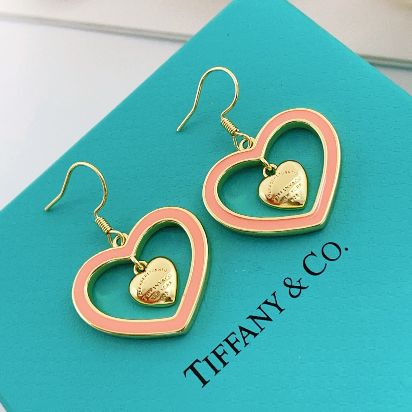Tiffany Co Return to Tiffany Double Heart earrings gold-tone metal with coral pink enamel 3 5cm drop length