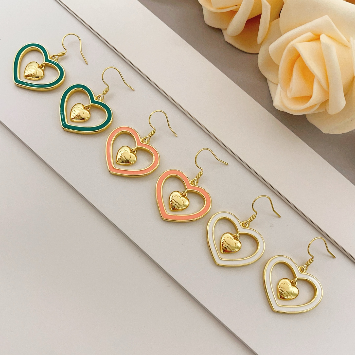 Tiffany Co Return to Tiffany Double Heart earrings gold-tone metal with teal enamel 3 5cm drop length