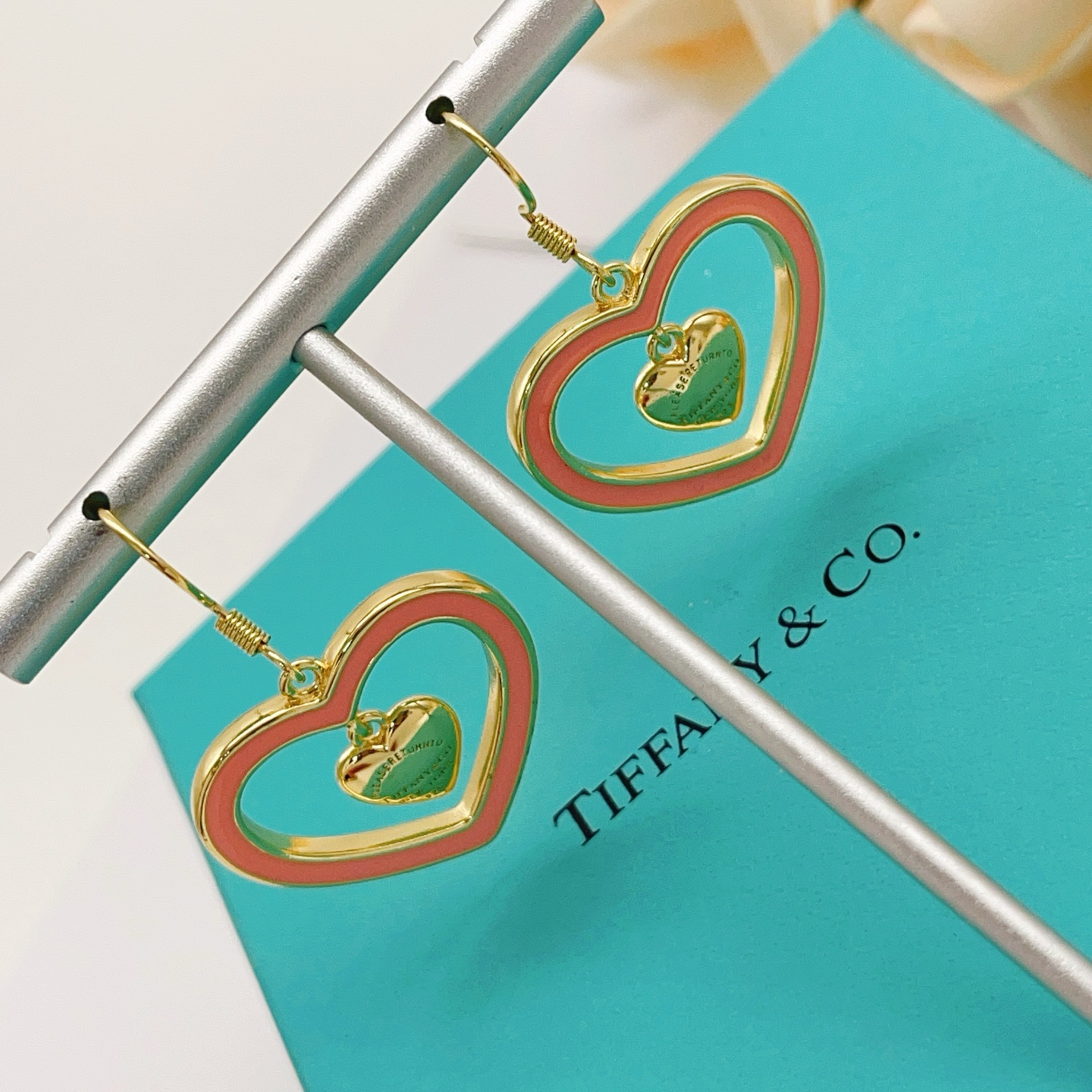 Tiffany Co Return to Tiffany Double Heart earrings gold-tone metal with coral pink enamel 3 5cm drop length