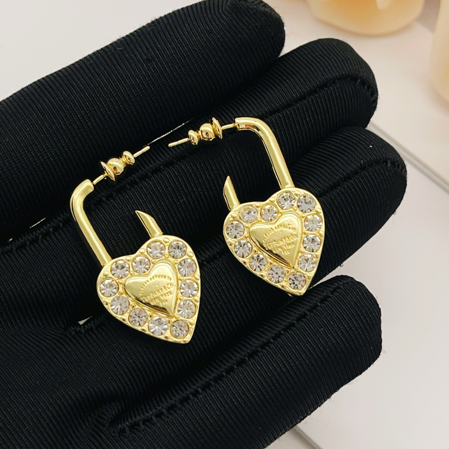 Tiffany Co Return to Tiffany Heart Lock earrings Gold-tone metal with clear faceted crystals One Size
