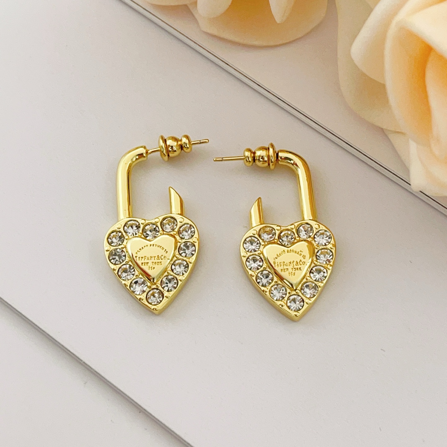 Tiffany Co Return to Tiffany Heart Lock earrings Gold-tone metal with clear faceted crystals One Size