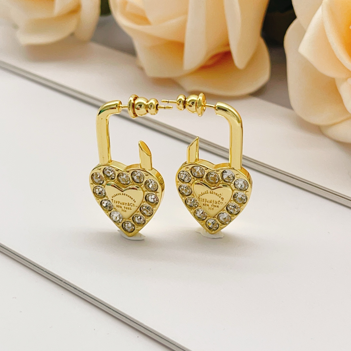 Tiffany Co Return to Tiffany Heart Lock earrings Gold-tone metal with clear faceted crystals One Size