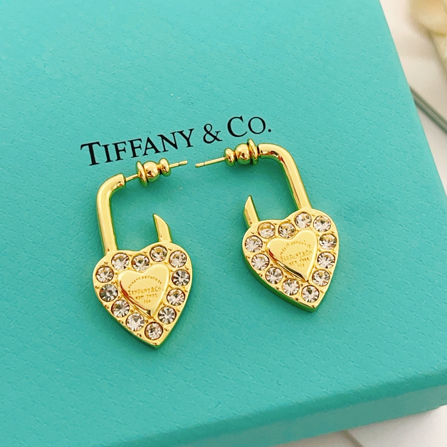Tiffany Co Return to Tiffany Heart Lock earrings Gold-tone metal with clear faceted crystals One Size