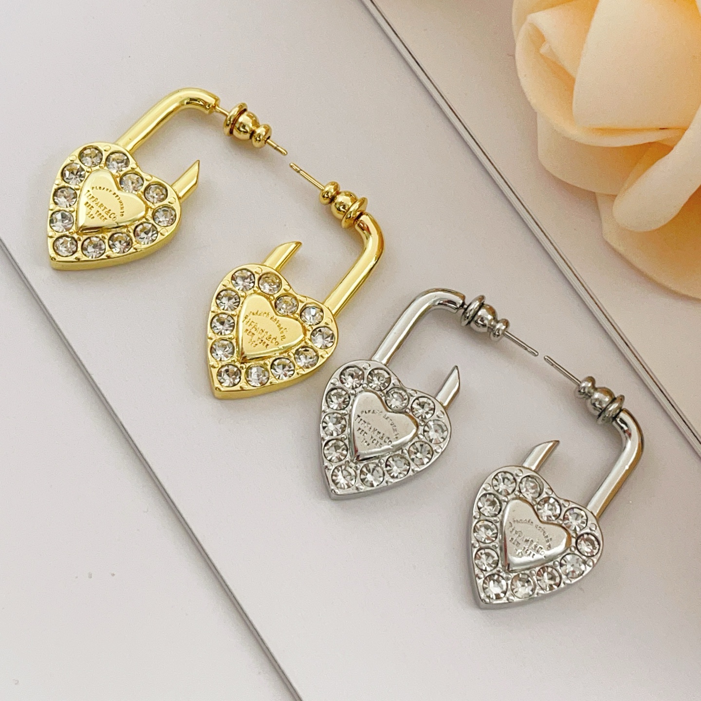 Tiffany Co Return to Tiffany Heart Lock earrings Gold-tone metal with clear faceted crystals One Size
