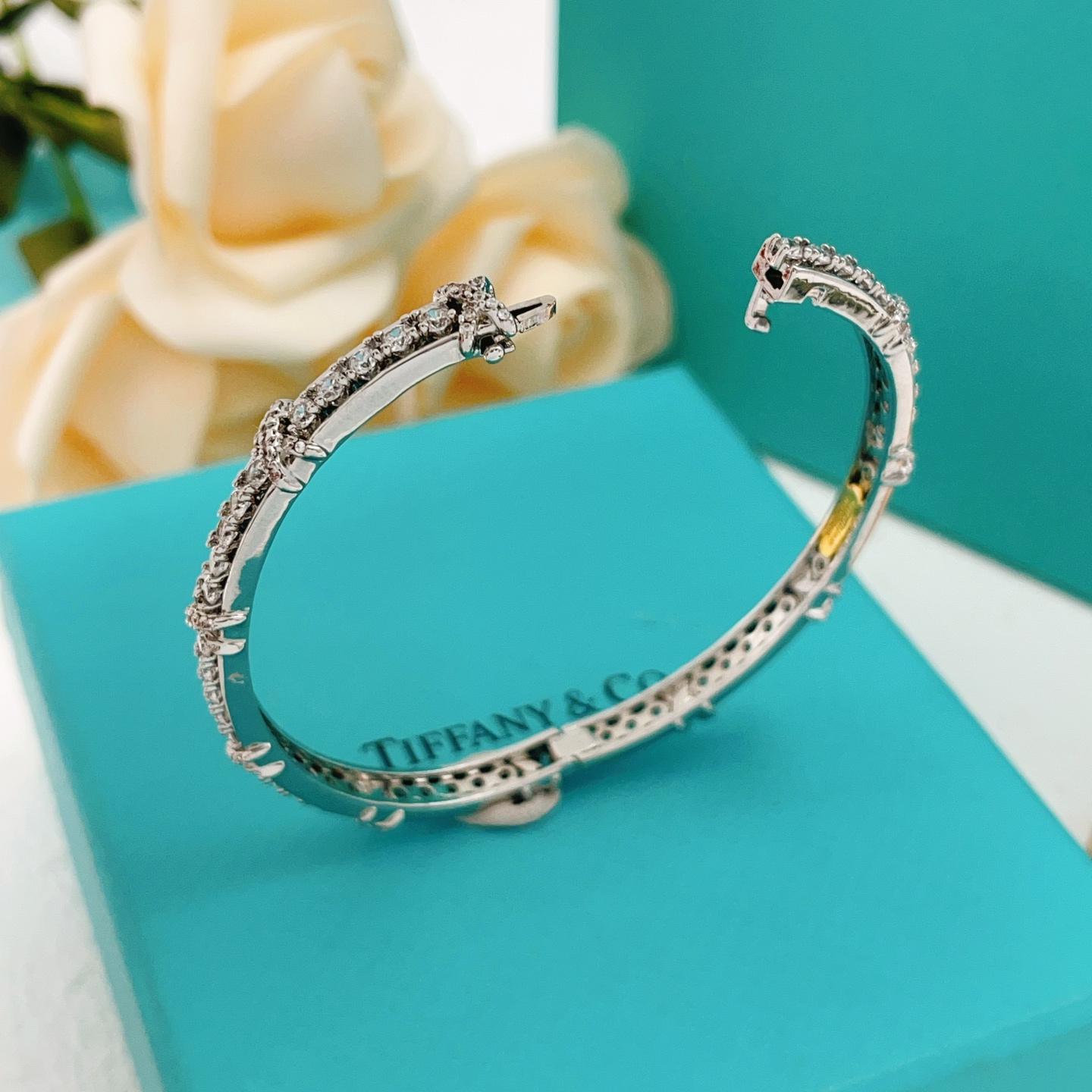 Tiffany Co Schlumberger X bracelet silver-toned white gold with clear diamond accents 17cm inner circumference
