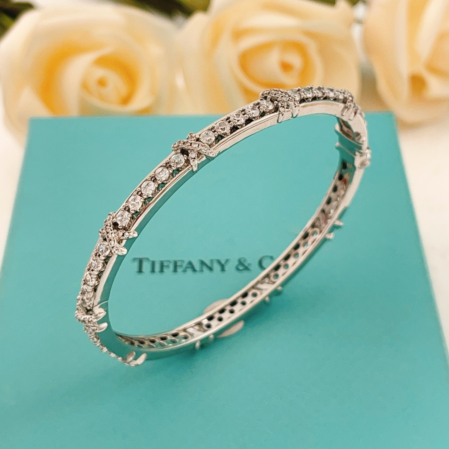 Tiffany Co Schlumberger X bracelet silver-toned white gold with clear diamond accents 17cm inner circumference