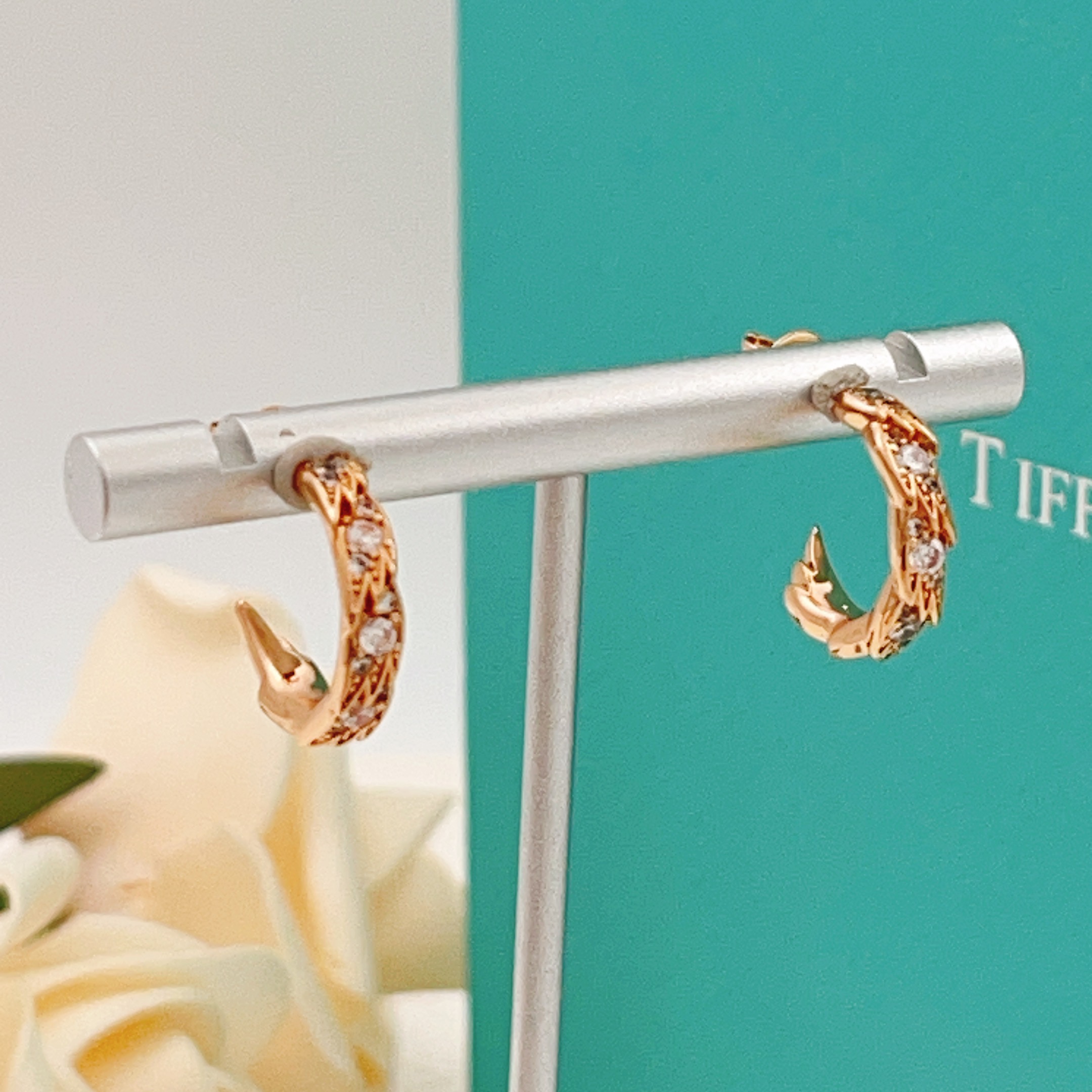 Tiffany Co Phoenix Tail Hoop Earrings earrings Gold-tone metal with clear round-cut cubic zirconia stones available in yellow gold rose gold and silver-tone metal finishes 15mm hoop diameter