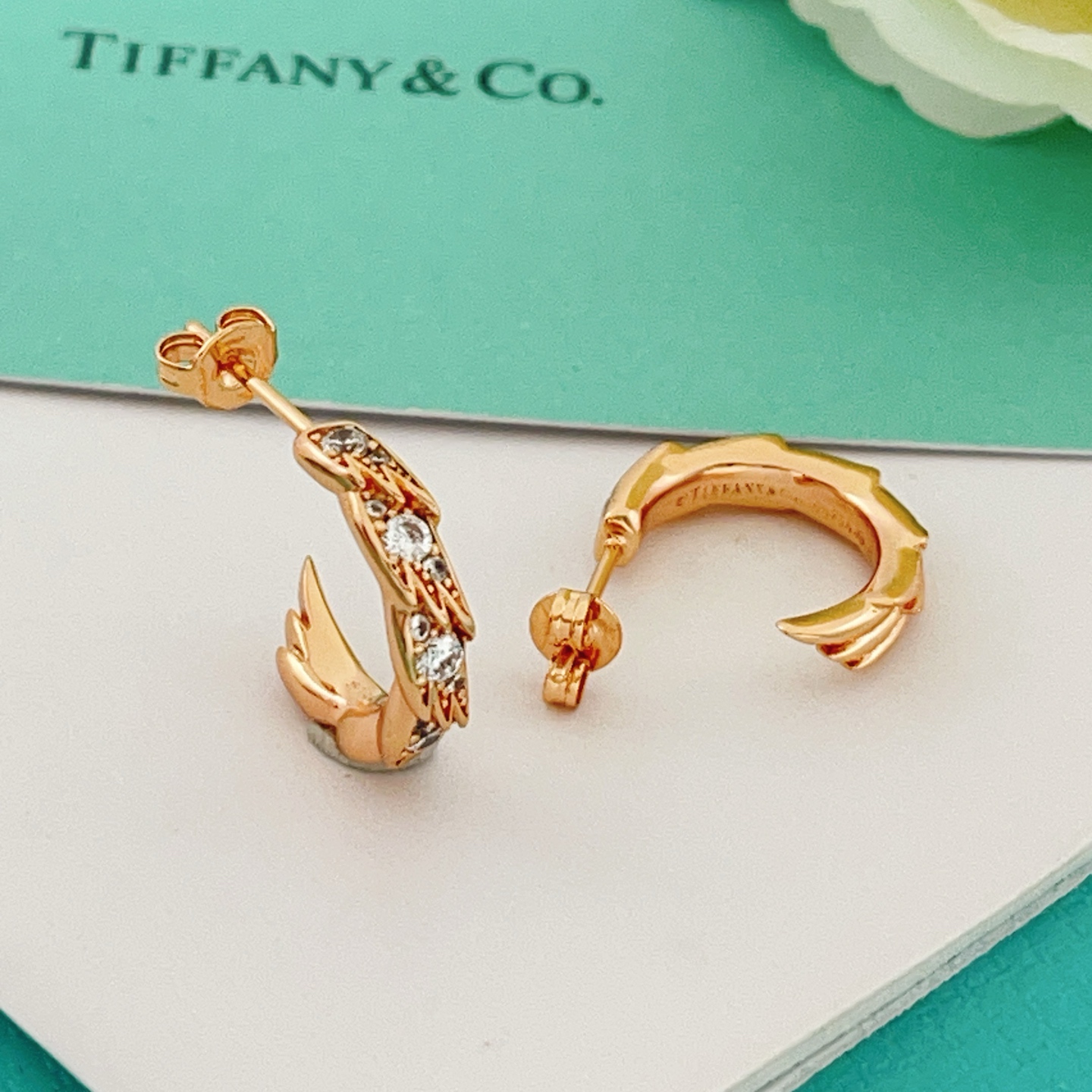 Tiffany Co Phoenix Tail Hoop Earrings earrings Gold-tone metal with clear round-cut cubic zirconia stones available in yellow gold rose gold and silver-tone metal finishes 15mm hoop diameter