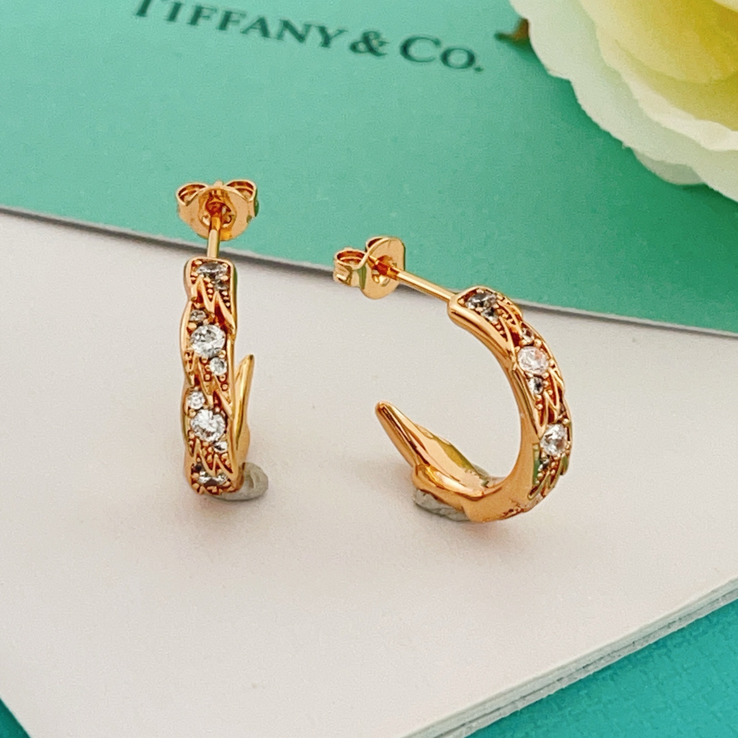 Tiffany Co Phoenix Tail Hoop Earrings earrings Gold-tone metal with clear round-cut cubic zirconia stones available in yellow gold rose gold and silver-tone metal finishes 15mm hoop diameter