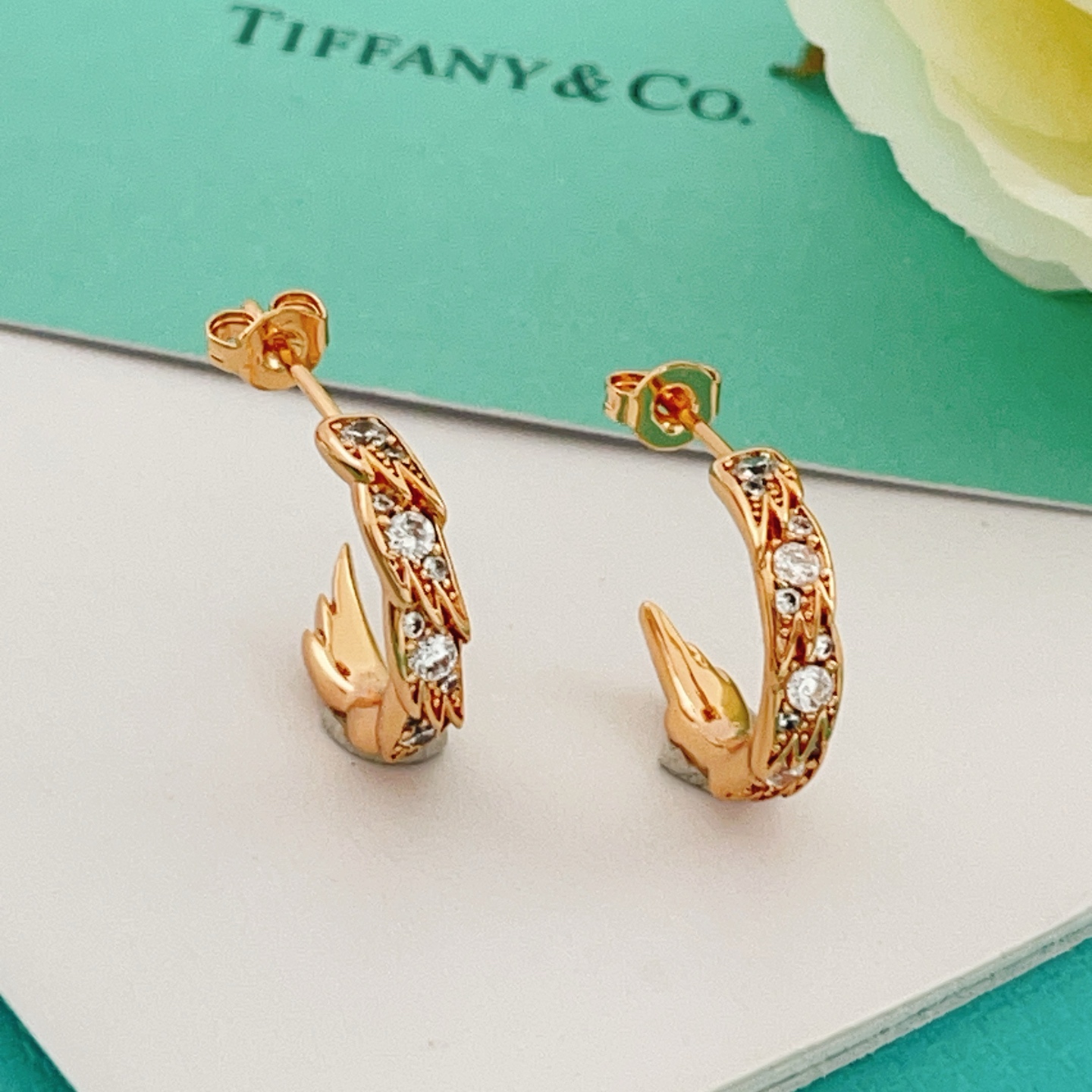 Tiffany Co Phoenix Tail Hoop Earrings earrings Gold-tone metal with clear round-cut cubic zirconia stones available in yellow gold rose gold and silver-tone metal finishes 15mm hoop diameter
