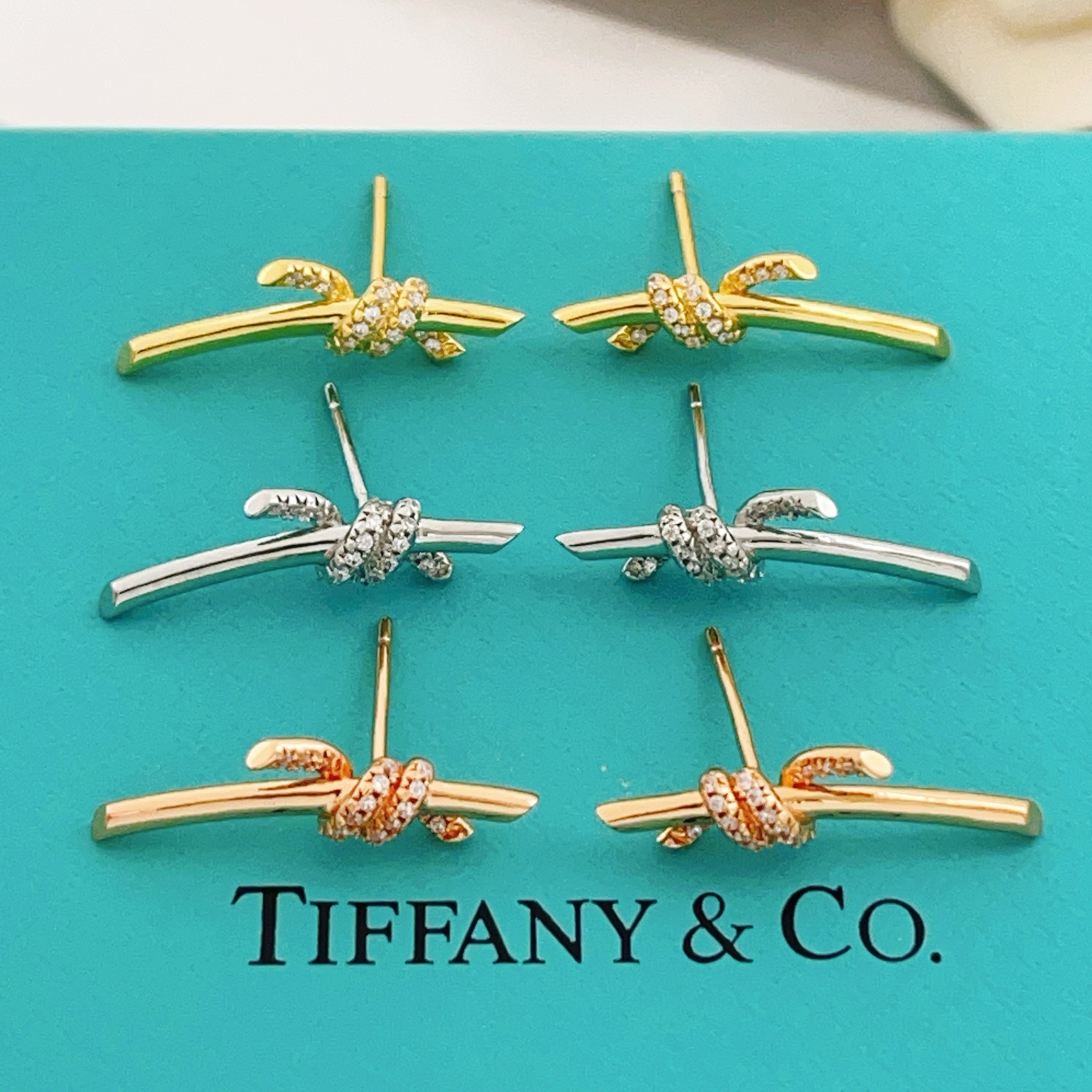 Tiffany Co Tiffany Knot earrings yellow gold with clear diamond accents 18mm bar length