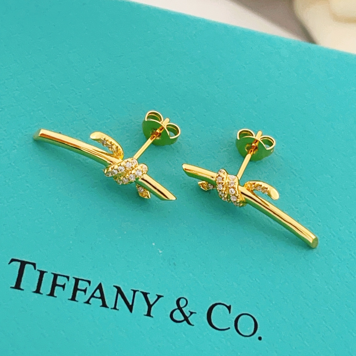 Tiffany Co Tiffany Knot earrings yellow gold with clear diamond accents 18mm bar length