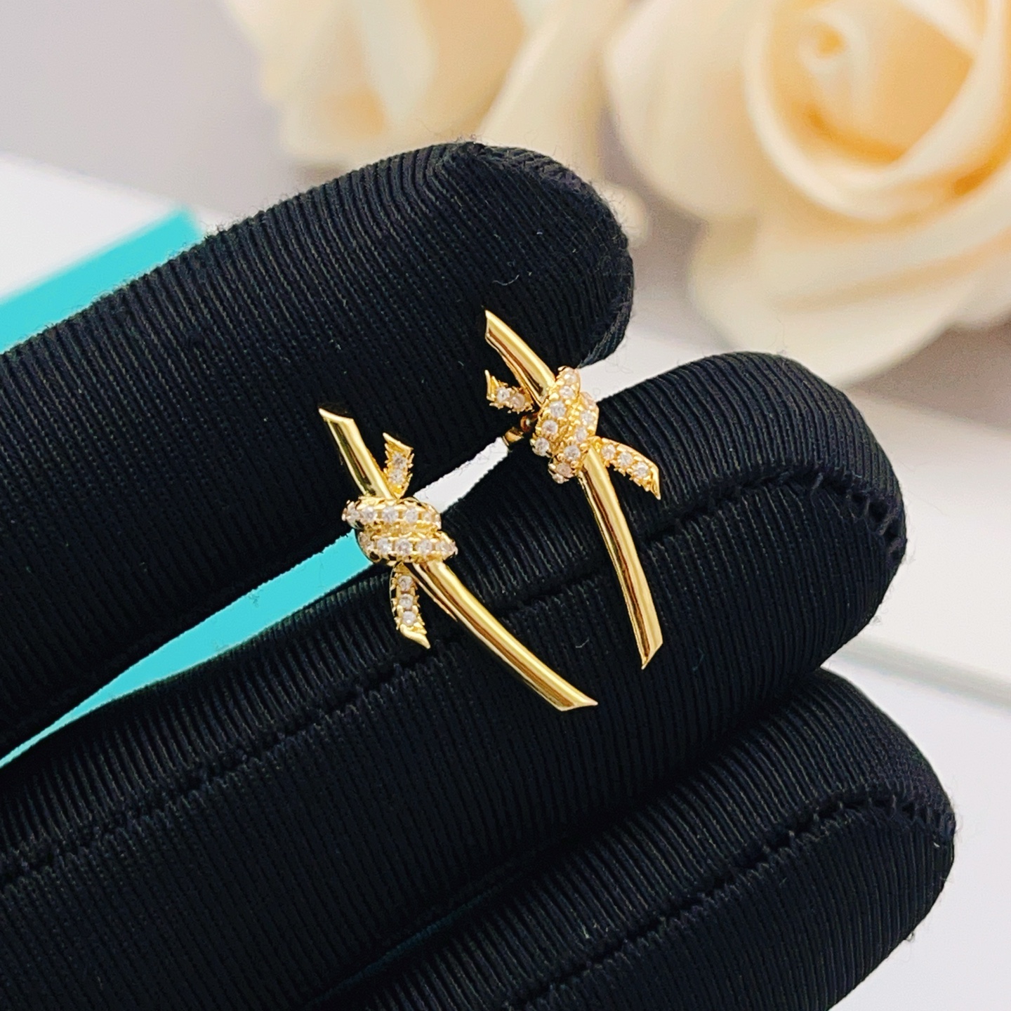 Tiffany Co Tiffany Knot earrings yellow gold with clear diamond accents 18mm bar length