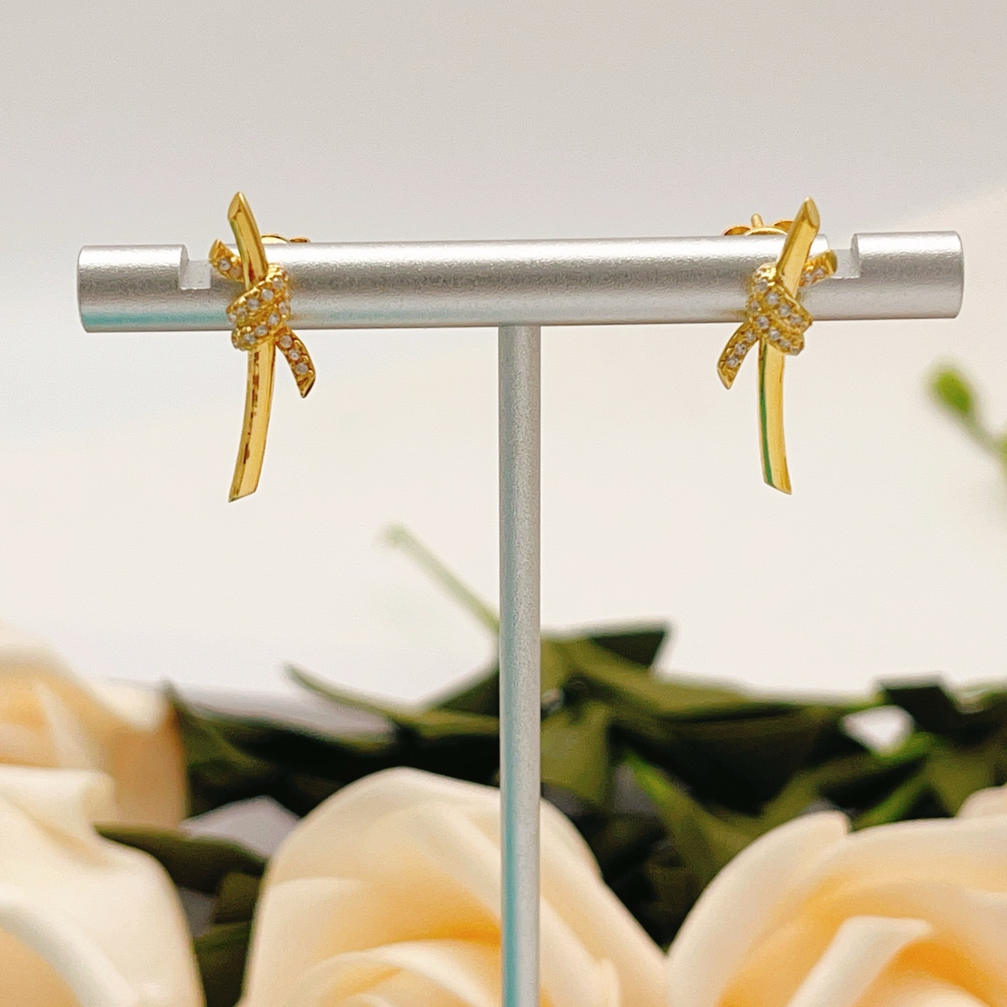 Tiffany Co Tiffany Knot earrings yellow gold with clear diamond accents 18mm bar length