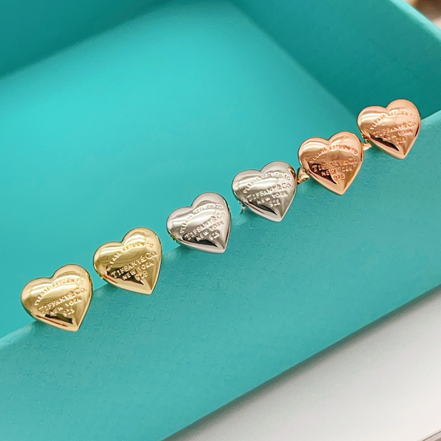 Tiffany Co Return to Tiffany Mini Heart earrings Rose gold-toned metal with engraved text detailing 8mm stud diameter