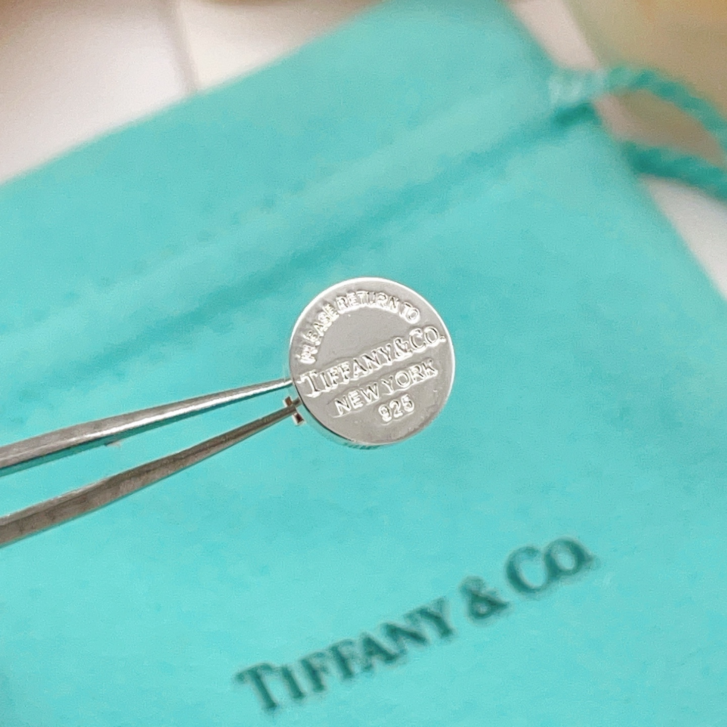 Tiffany Co Return to Tiffany earrings sterling silver with navy blue enamel 10mm diameter