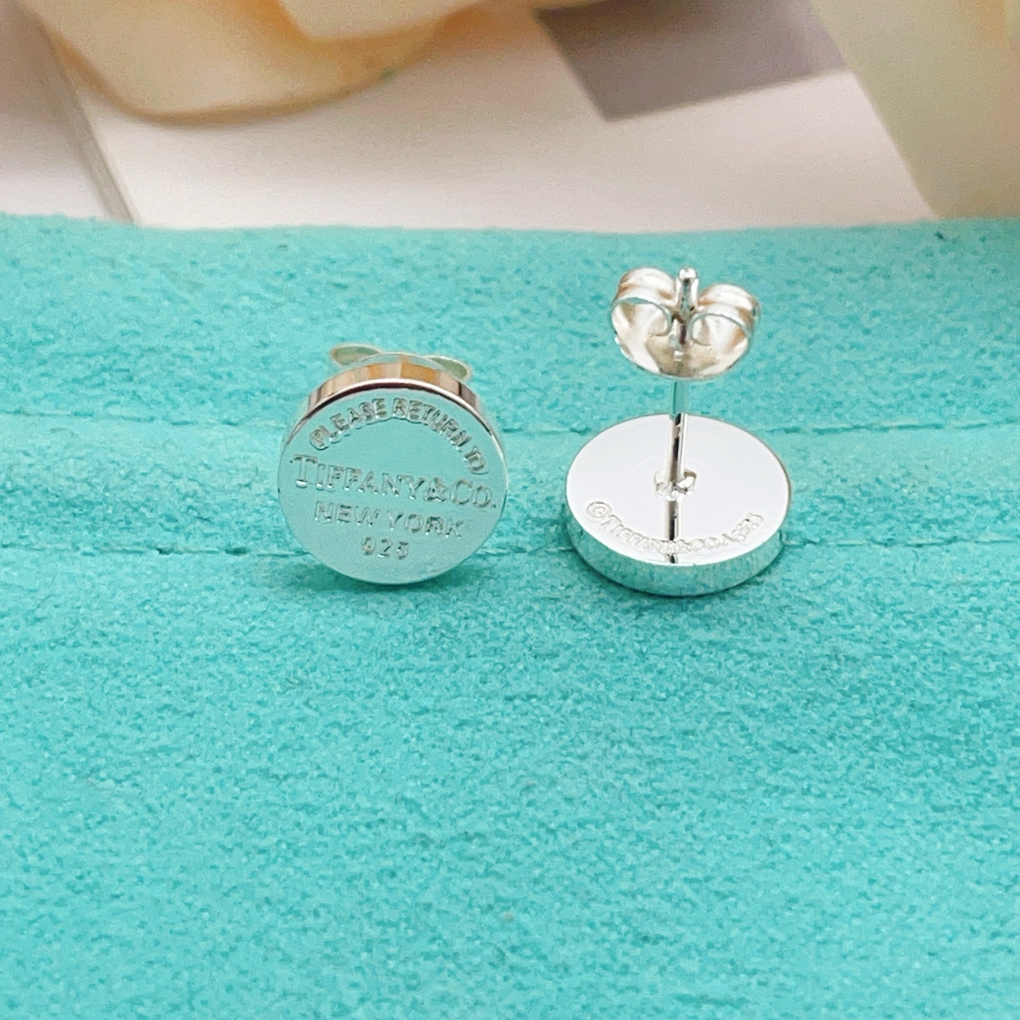 Tiffany Co Return to Tiffany earrings sterling silver with navy blue enamel 10mm diameter