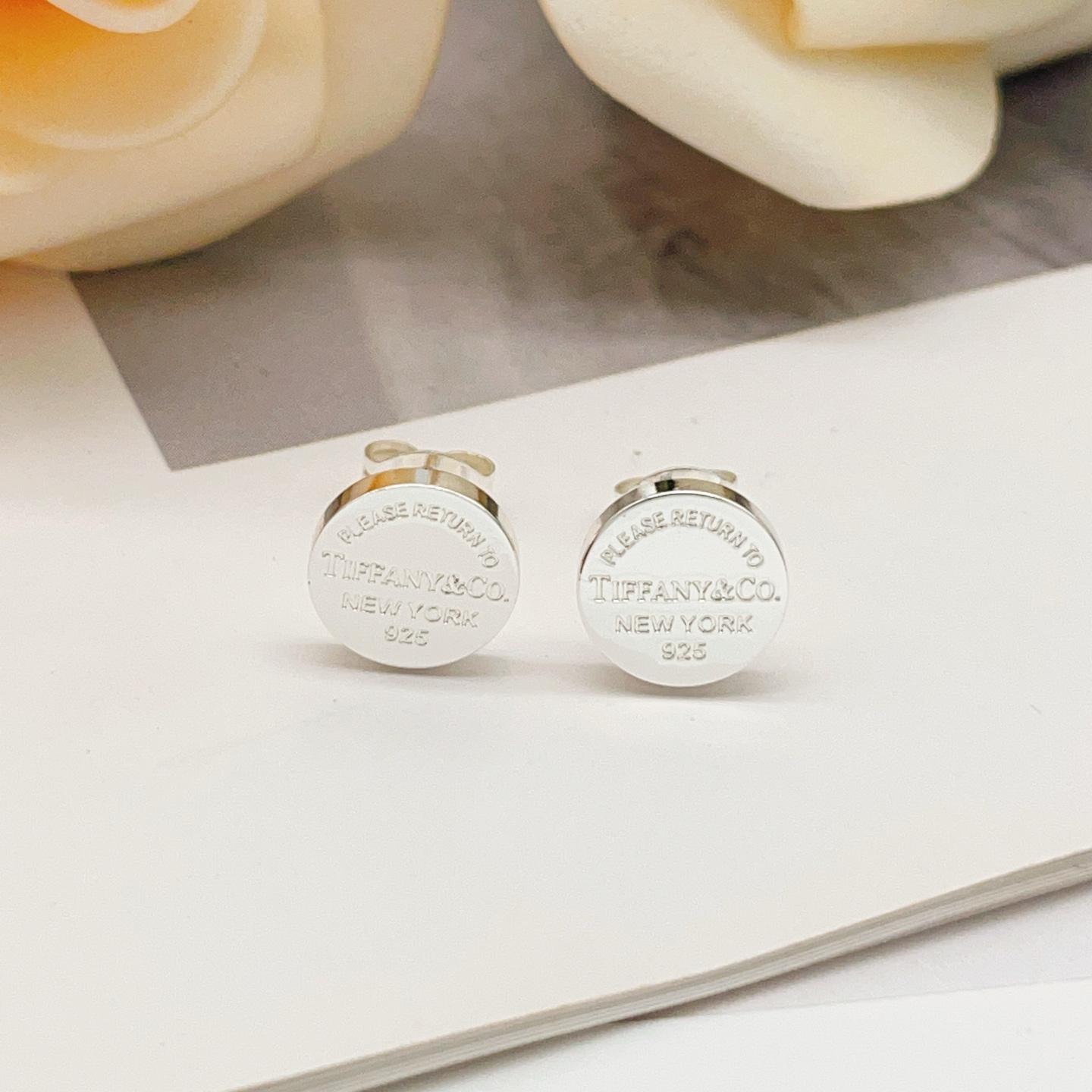 Tiffany Co Return to Tiffany earrings sterling silver with navy blue enamel 10mm diameter