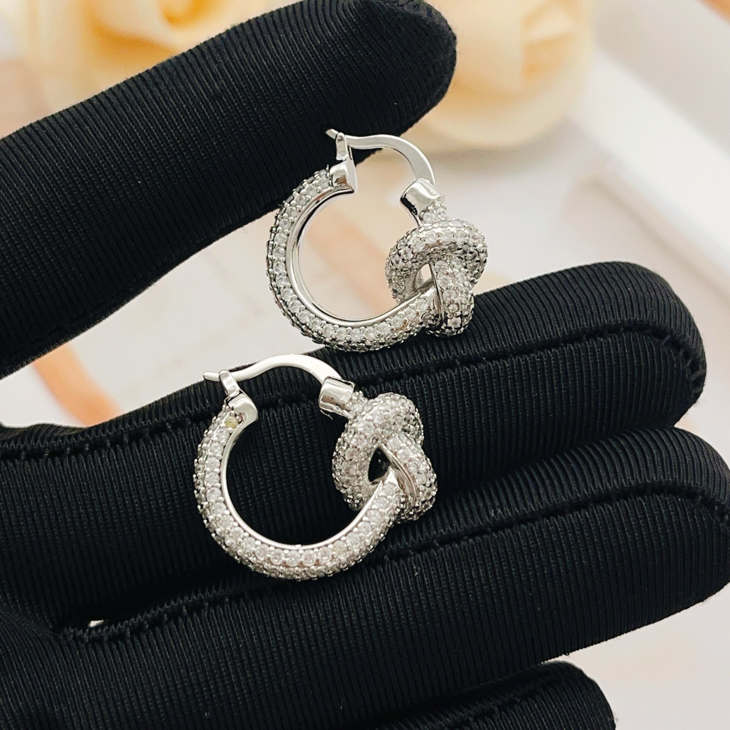 Tiffany Co Knot earrings silver-toned metal with clear pave diamonds 15mm hoop diameter