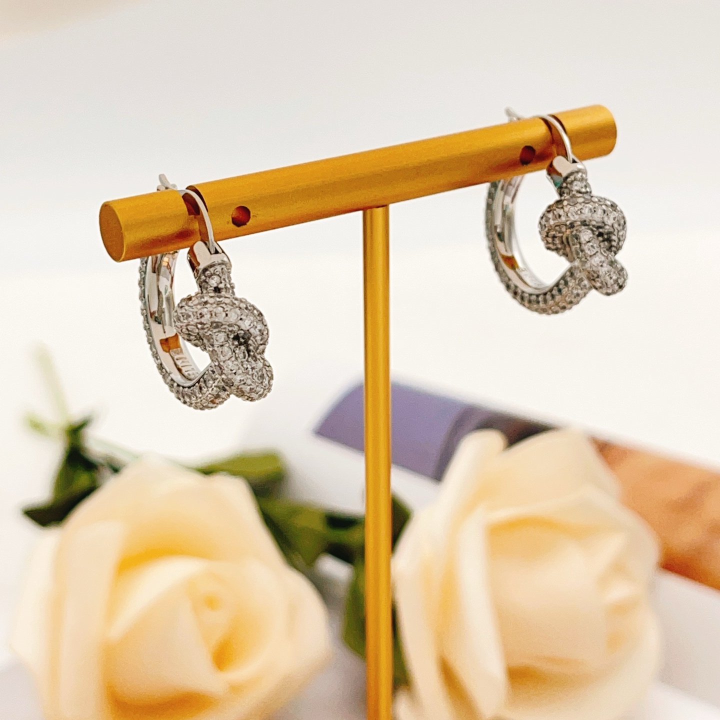 Tiffany Co Knot earrings silver-toned metal with clear pave diamonds 15mm hoop diameter
