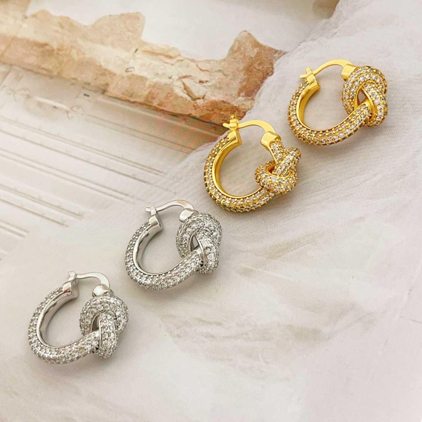 Tiffany Co Knot earrings yellow gold metal with clear pave diamonds 15mm hoop diameter