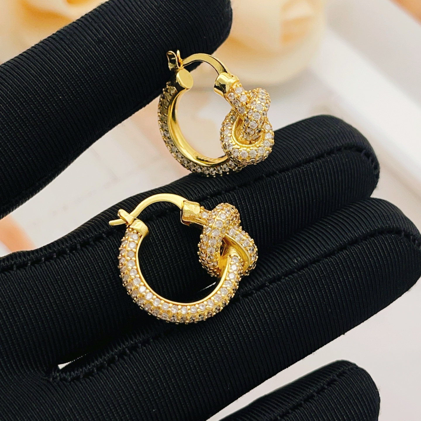 Tiffany Co Knot earrings yellow gold metal with clear pave diamonds 15mm hoop diameter