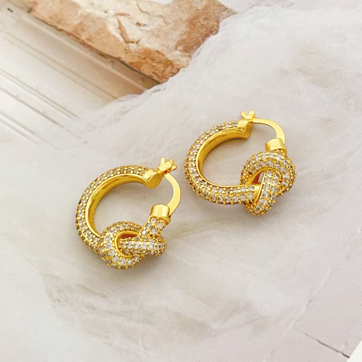 Tiffany Co Knot earrings yellow gold metal with clear pave diamonds 15mm hoop diameter