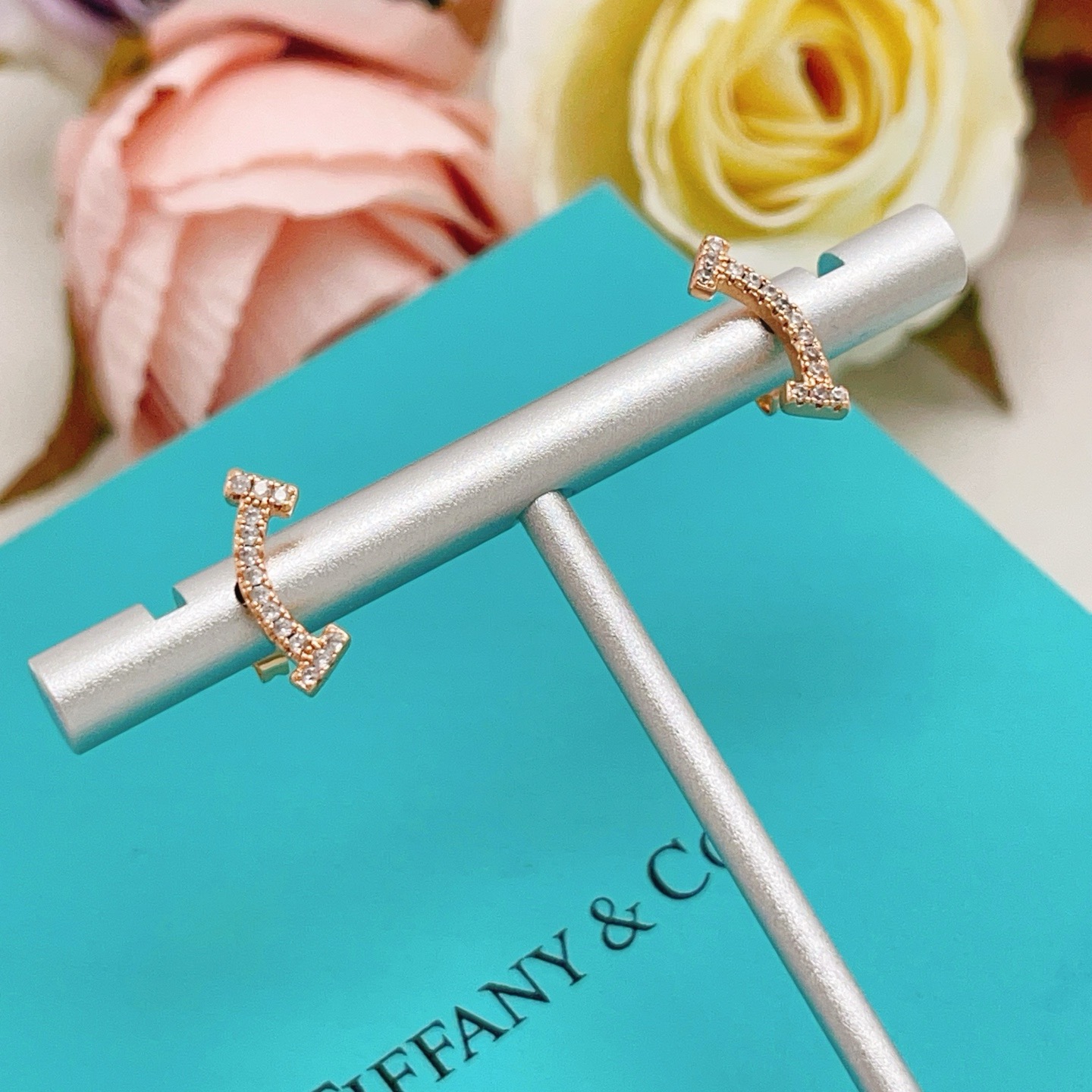 Tiffany Co T Smile earrings 18k rose gold with clear diamonds 10mm width