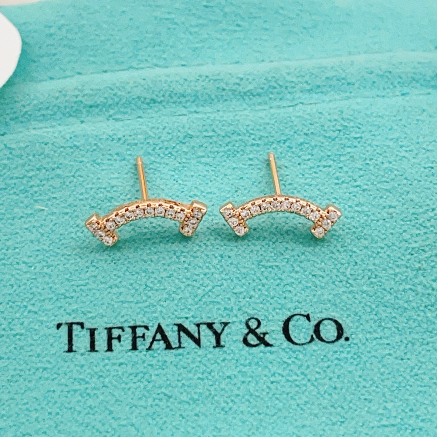 Tiffany Co T Smile earrings 18k rose gold with clear diamonds 10mm width