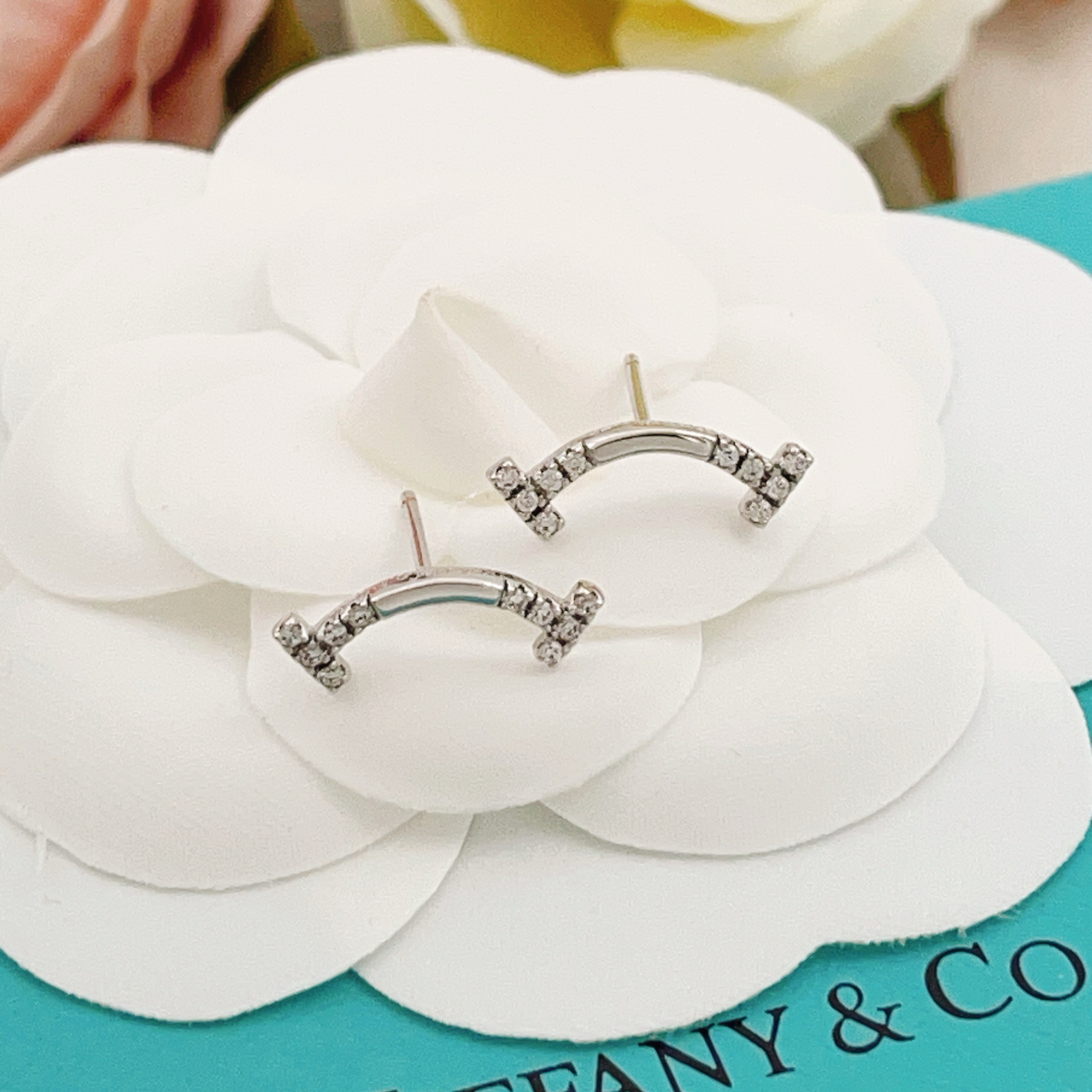 Tiffany Co T Smile earrings silver-toned white gold with clear diamond accents 12mm width