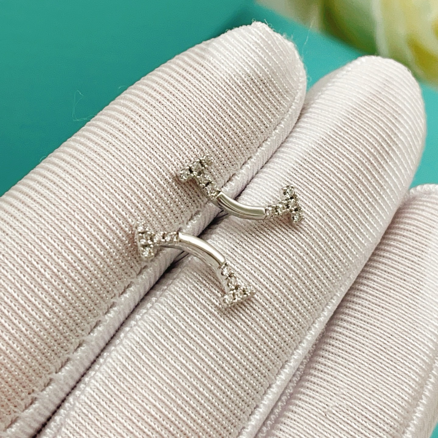 Tiffany Co T Smile earrings silver-toned white gold with clear diamond accents 12mm width