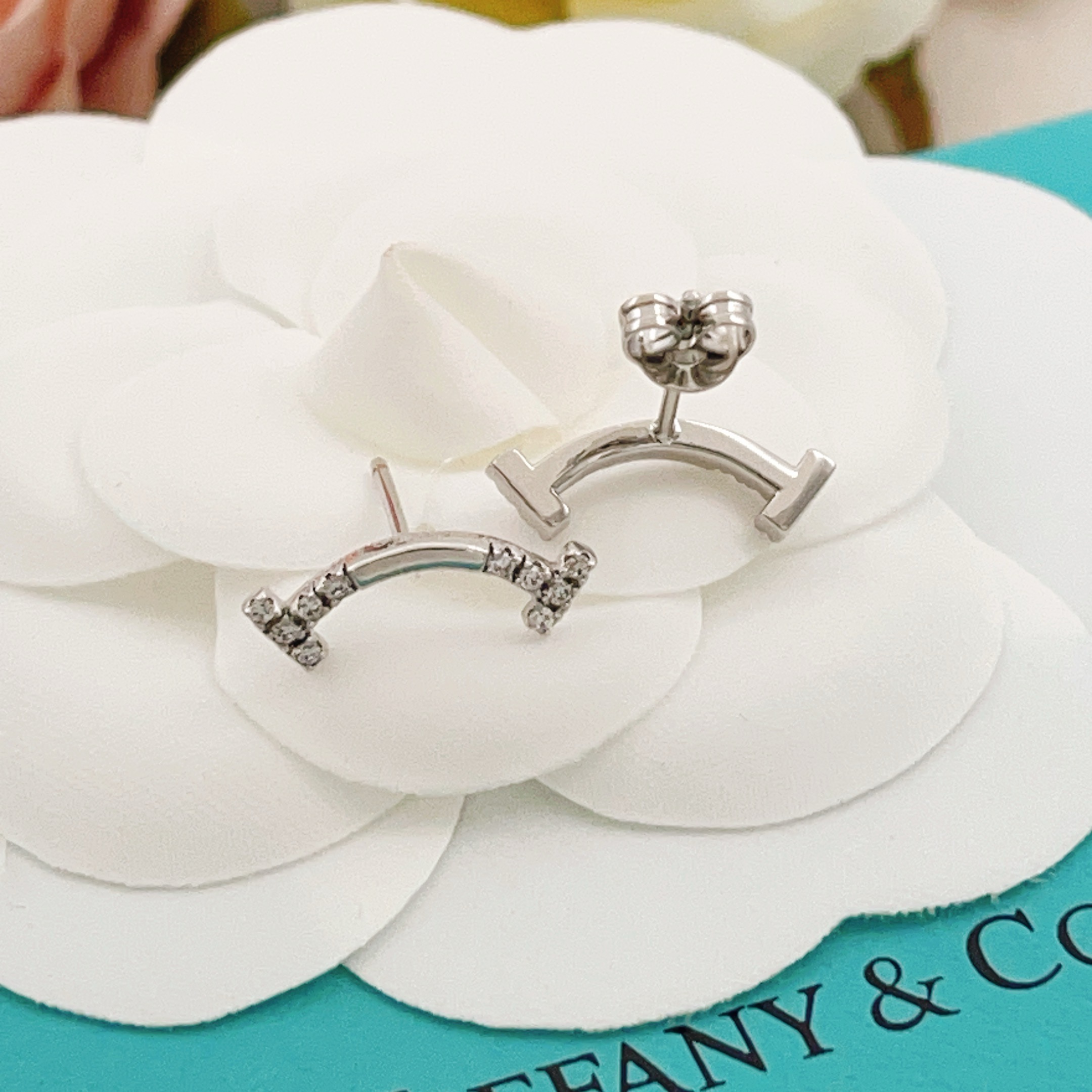 Tiffany Co T Smile earrings silver-toned white gold with clear diamond accents 12mm width