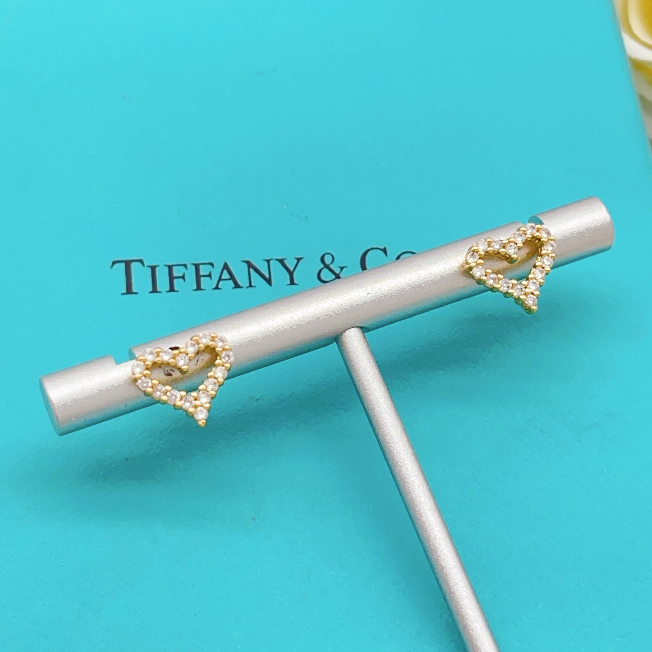 Tiffany Skeleton Heart earrings gold-tone metal with clear pave stones 8mm stud diameter
