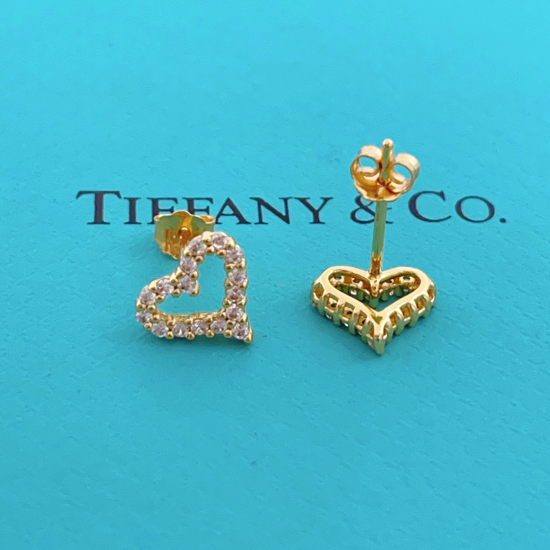 Tiffany Skeleton Heart earrings gold-tone metal with clear pave stones 8mm stud diameter