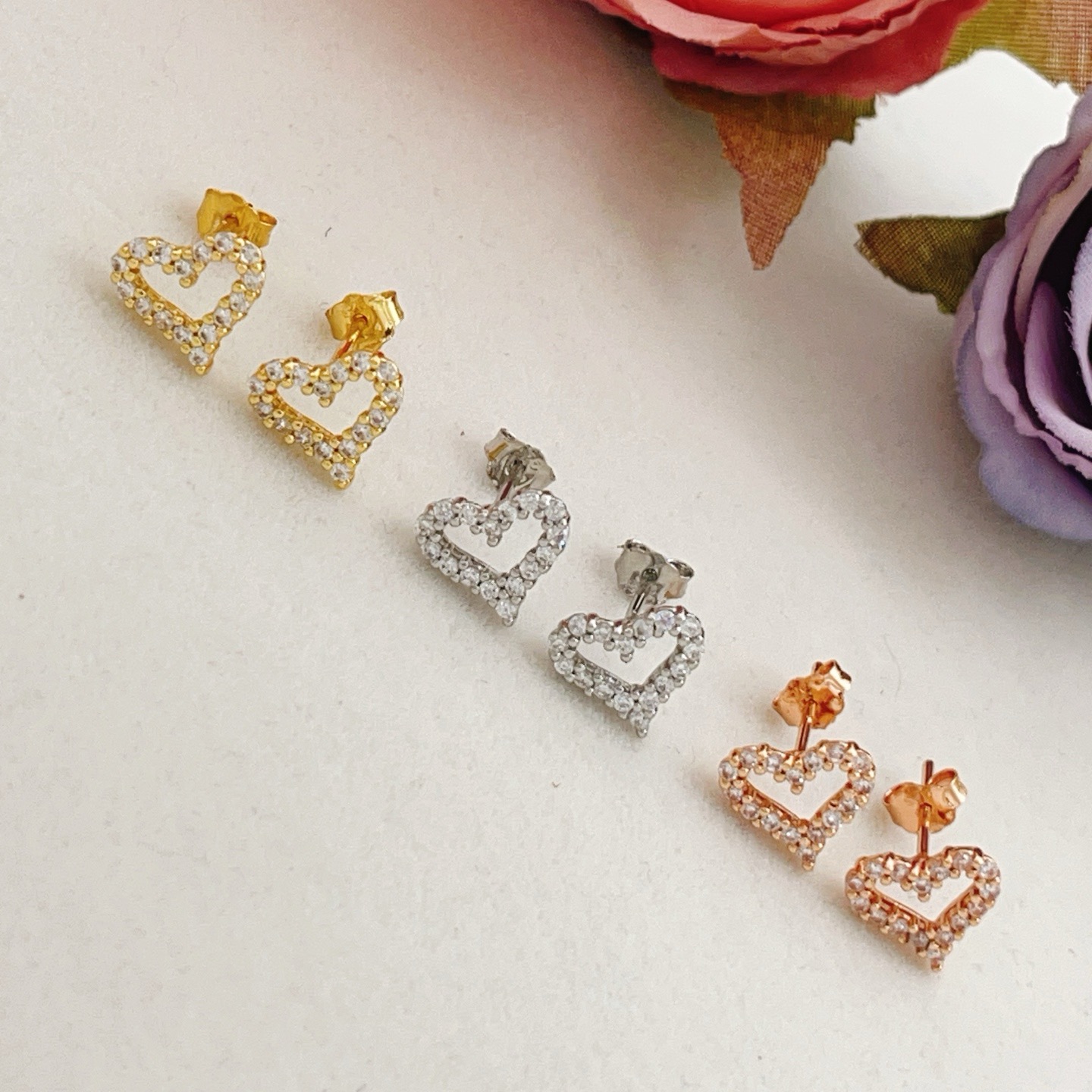 Tiffany Skeleton ZP Heart Stud Earrings earrings Available in yellow gold rose gold and silver-toned metal all set with clear faceted stones 8mm stud diameter
