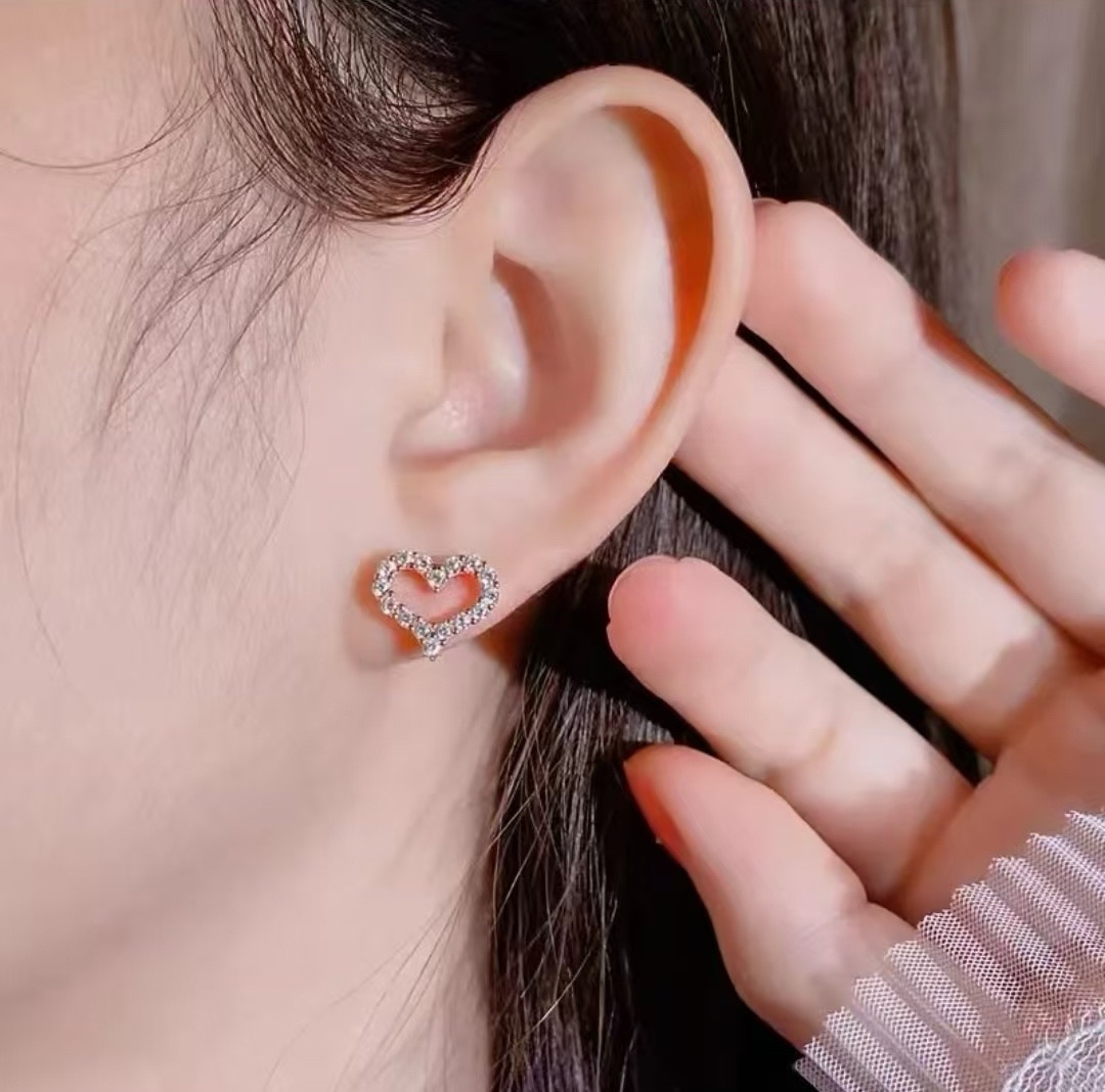 Tiffany Skeleton ZP Heart Stud Earrings earrings Available in yellow gold rose gold and silver-toned metal all set with clear faceted stones 8mm stud diameter