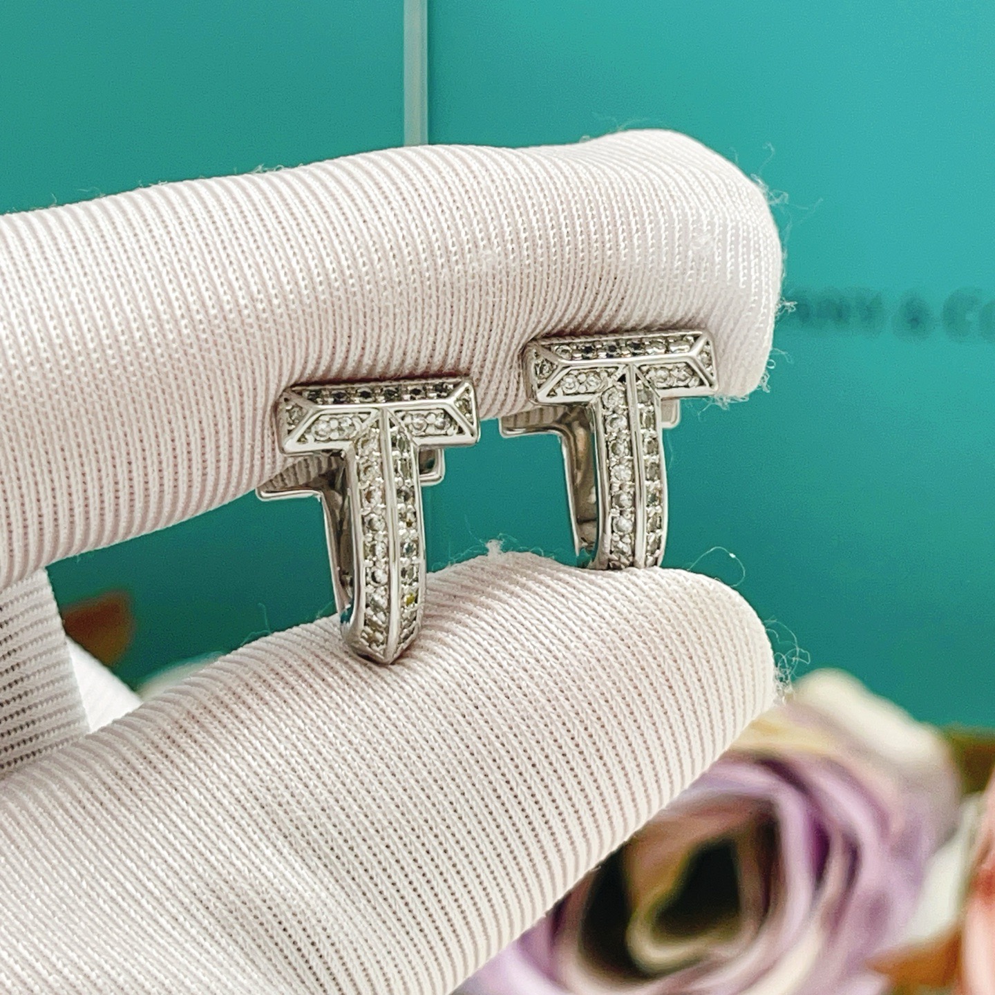Tiffany Co Tiffany T earrings silver-toned metal with clear diamond accents 10mm
