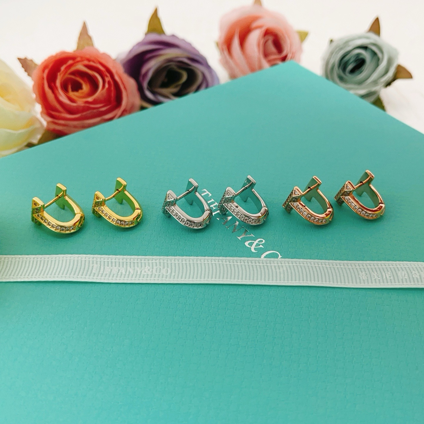 Tiffany Co Tiffany T earrings silver-toned metal with clear diamond accents 10mm